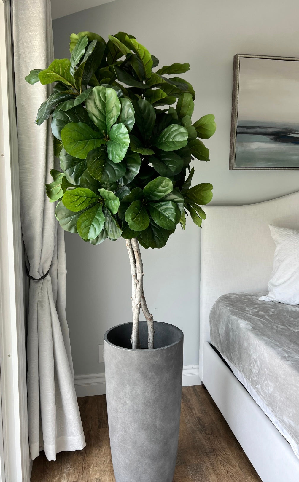 Authentic-looking fig fiddle leaf plant with glossy, deep green leaves and prominent veins, built on mountain lilac wood trunks in a paper mache base, ready for your own container.