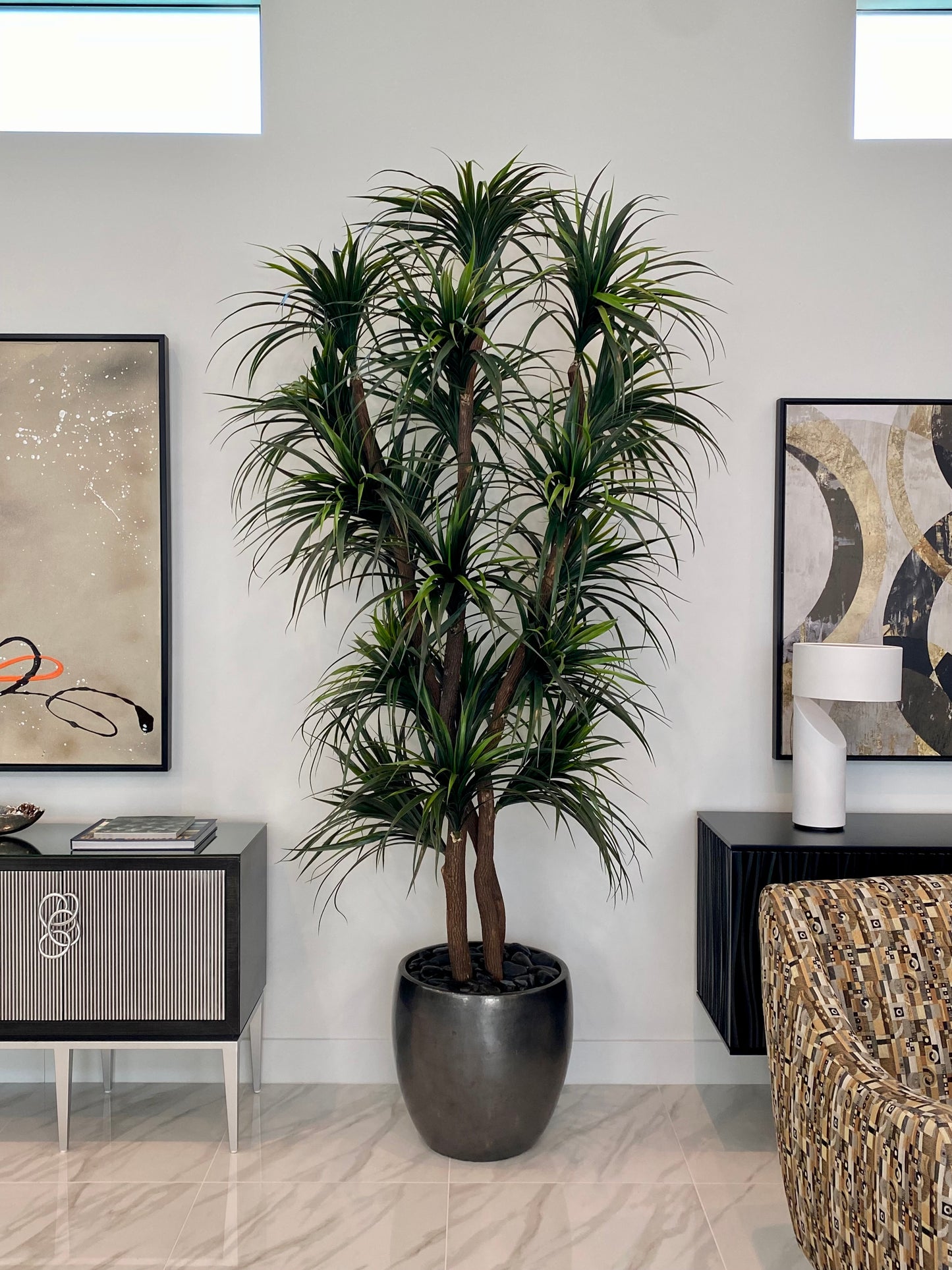 10-foot artificial yucca tree with spiky green leaves in a sleek, pewter-colored planter.