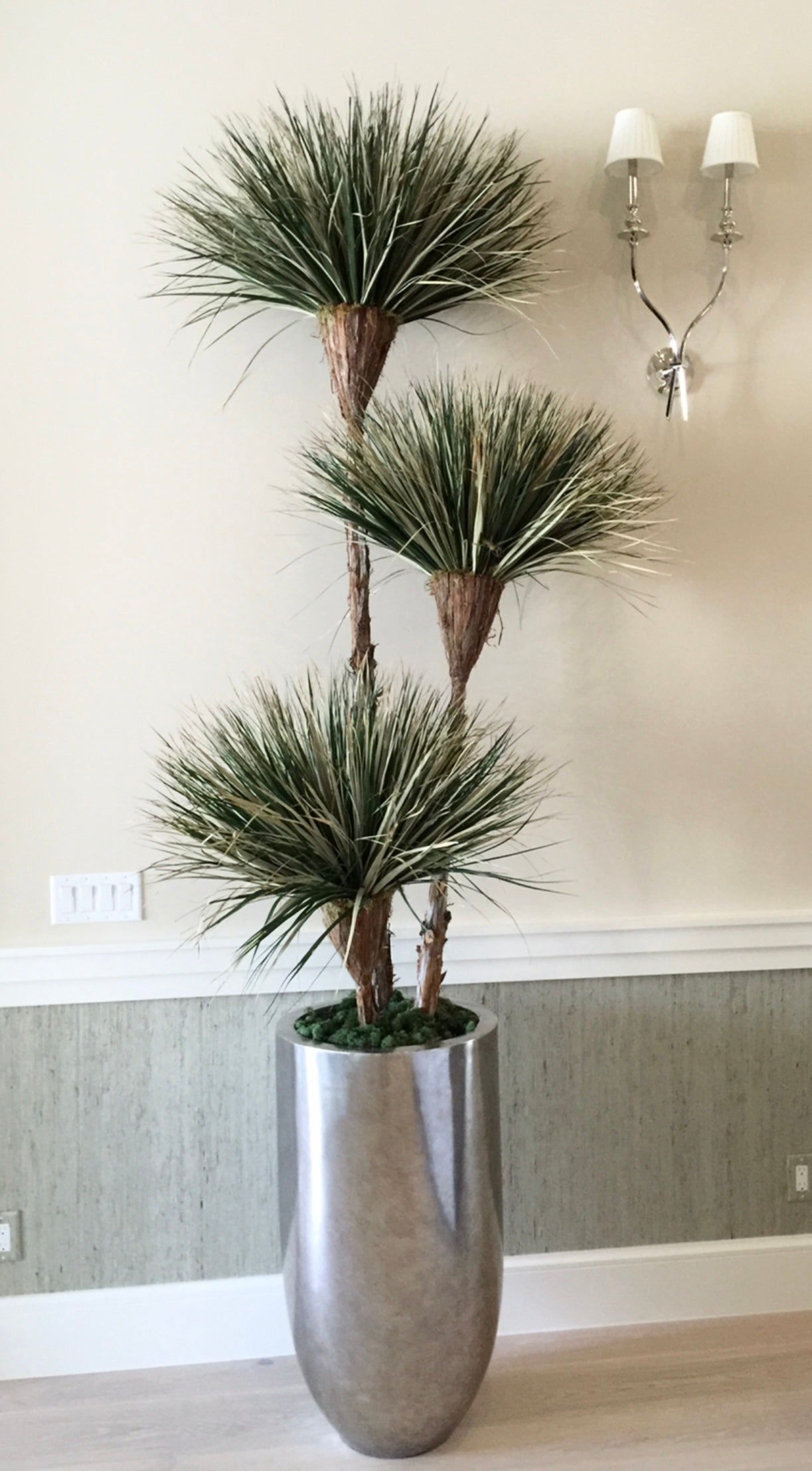 Exclusive desert southwest-inspired tree with natural dried and preserved materials, featuring 3-bloom greenery on cedar wood. Recommended for indoor use."This container sold separately